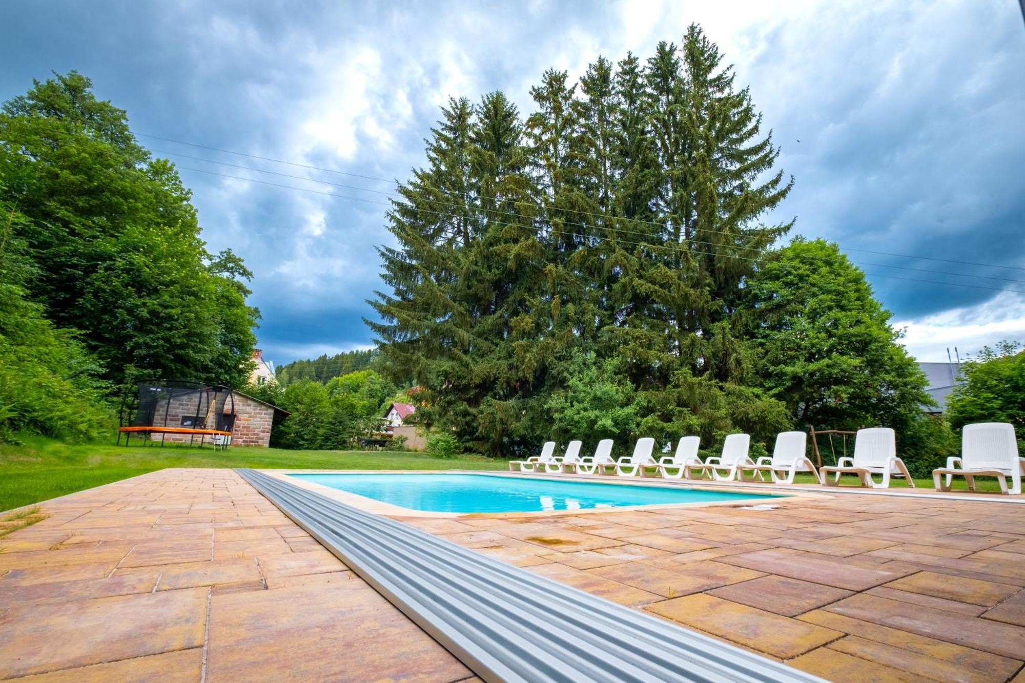 With A Covered Pool, Park, And Playground